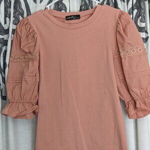 On twelfth puff sleeve shirt